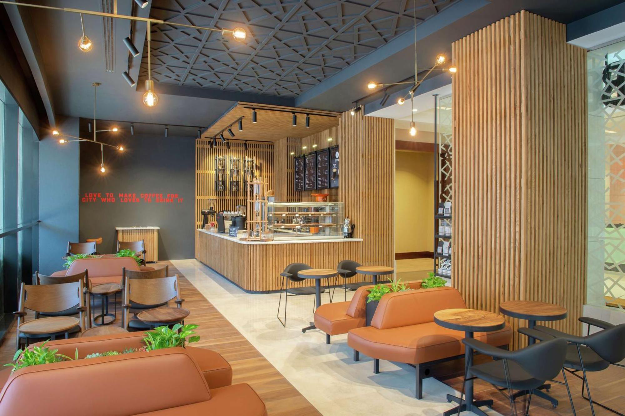 Doubletree By Hilton Doha - Al Sadd Hotel Buitenkant foto Interior of a Starbucks Reserve store in Seoul, South Korea